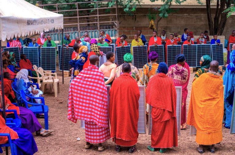 Women receiving solar equipment at the Kigongoni Fodder Factory